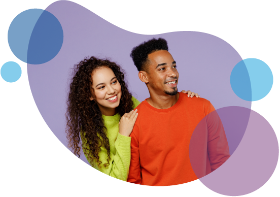Couple smiling wearing orange and green