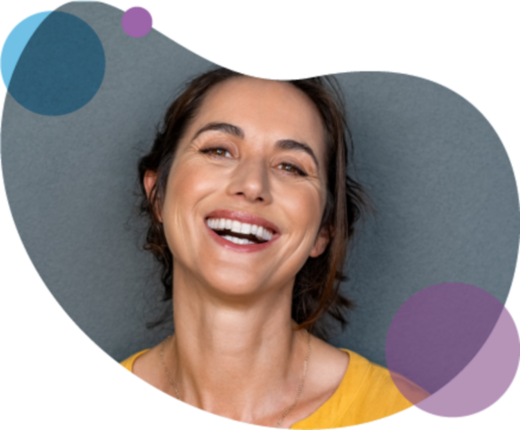 Woman smiling on grey and purple background