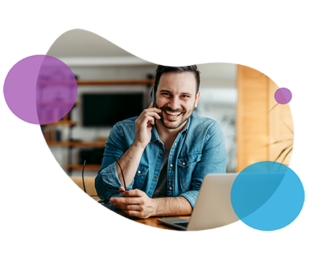 A man smiling while using a smartphone on an abstract background
