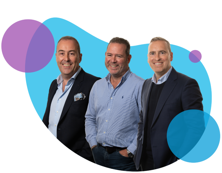 Three men in business attire smiling on abstract background