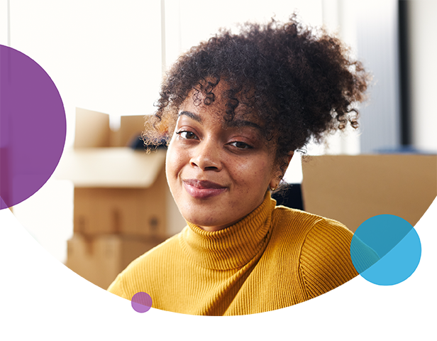 Woman smiling with curly hair on white background with circles