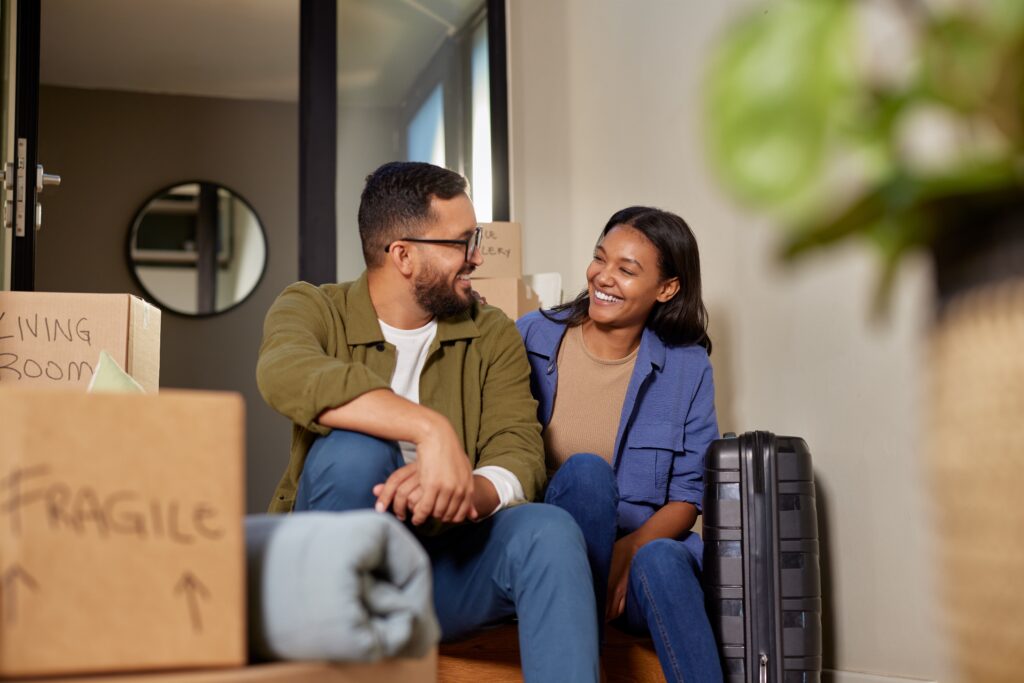 Couple sitting together after moving house