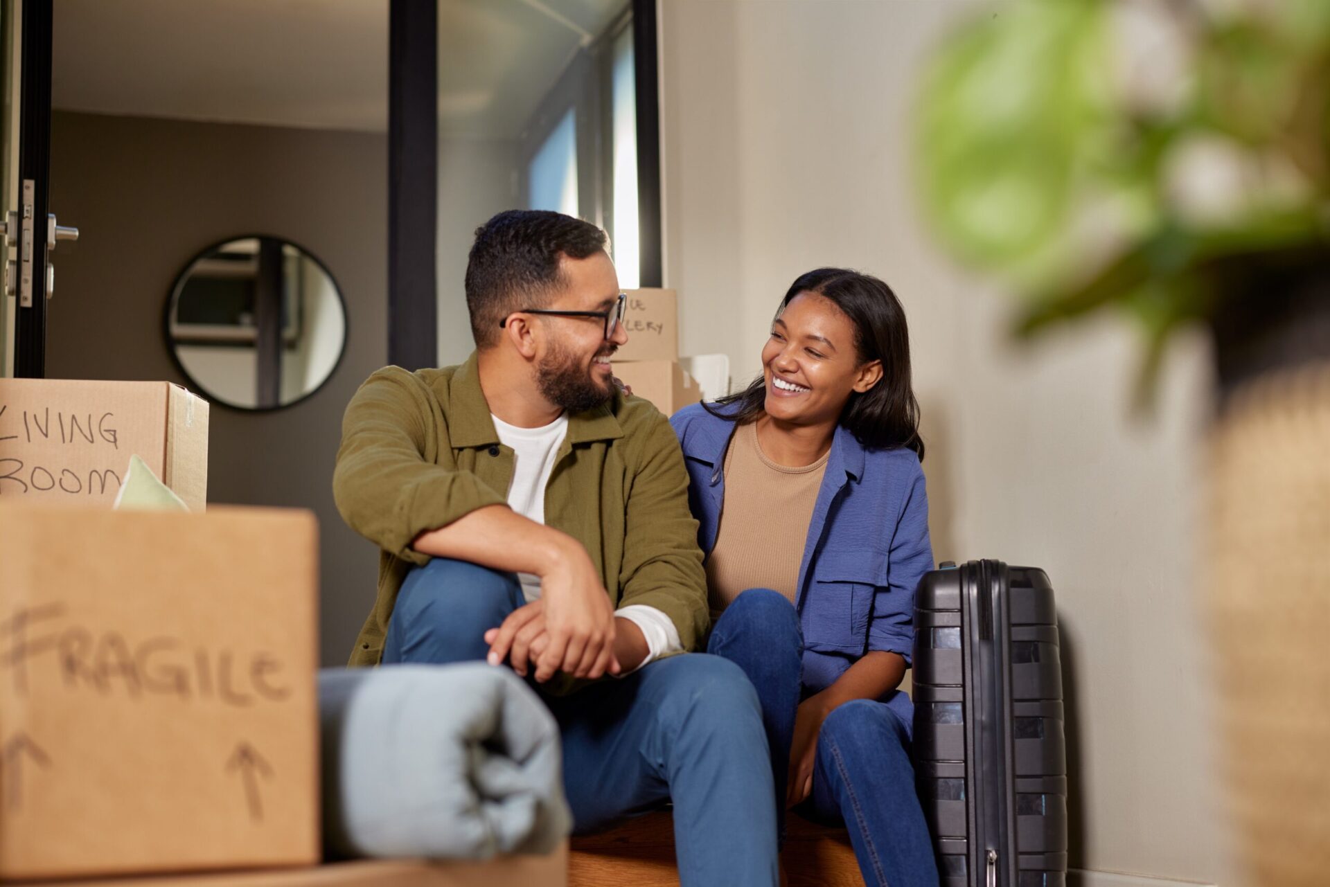 Couple sitting together after moving house