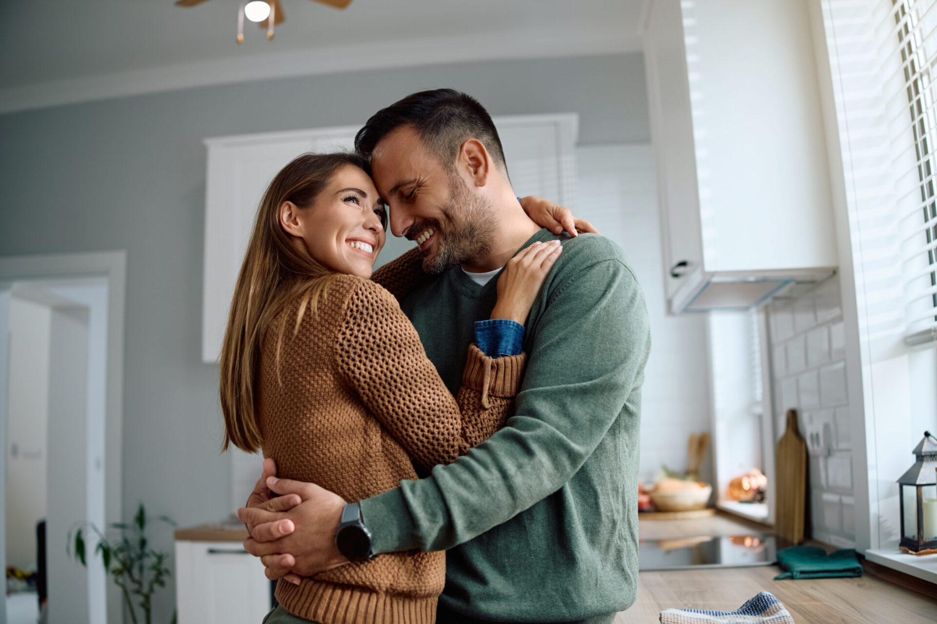 Couple embracing and smiling